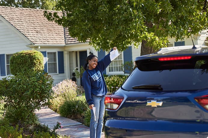 a man standing next to a car